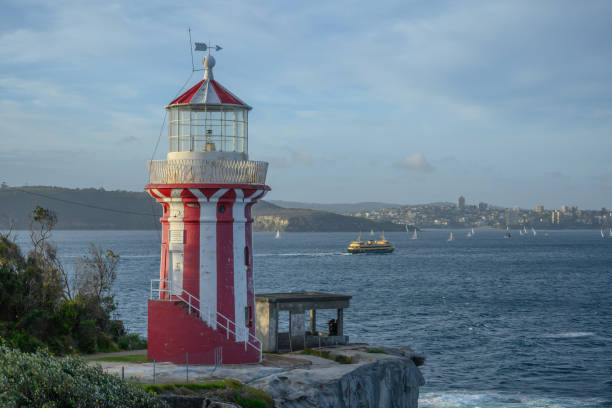 A mid-range shot of the Hornby Lighthouse with a Freshwater class Manly Ferry passing in the background.