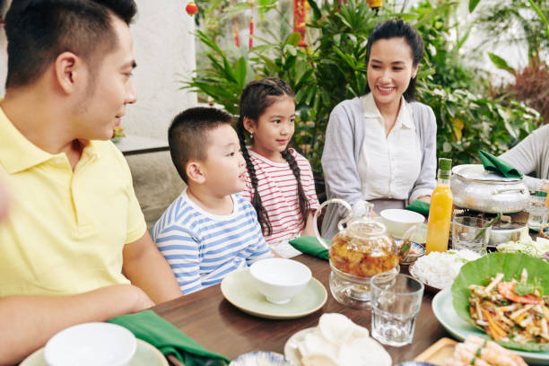 istock Boy reciting poem at family dinner 1300475508