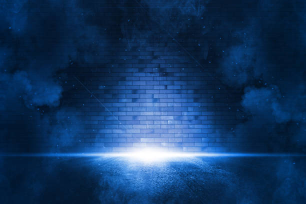 istock Rays searchlight light blue neon . Dark empty scene with  smoke. Reflections on wet asphalt. 1300475568