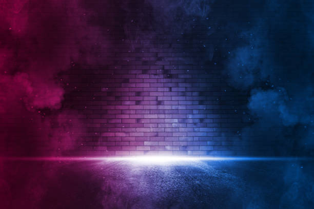 Rays neon light on neon brick wall. Empty scene. Neon reflections on wet asphalt. Cyberpunk background with copy space. Rays neon light on neon brick wall. Empty scene. Neon reflections on wet asphalt. Cyberpunk background with copy space brick wall photos stock pictures, royalty-free photos & images
