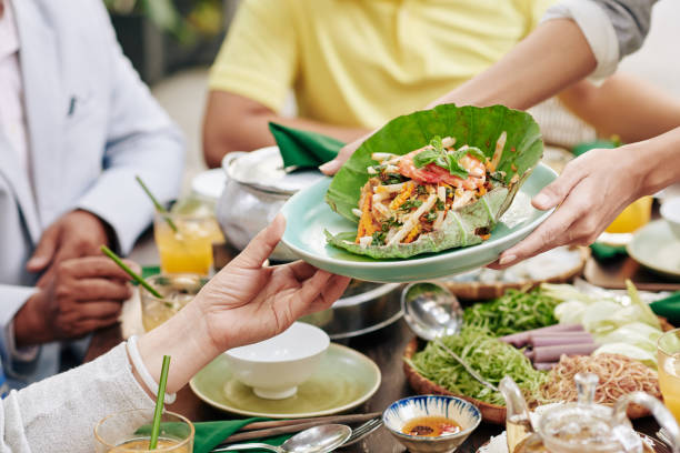 istock Housewife offering salad 1300475604