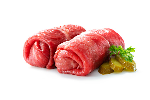 Raw beef roulades isolated on white background
