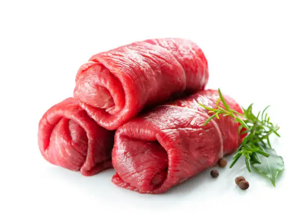 Raw beef roulades isolated on white background