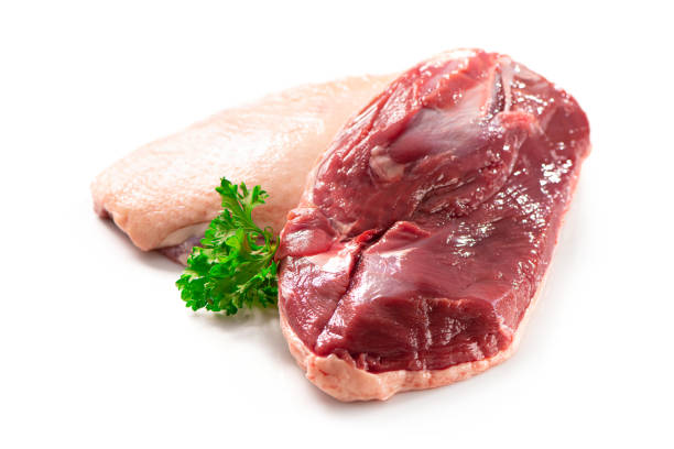 istock Raw duck breast pieces isolated on white background 1300477399