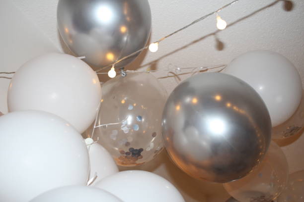 istock White and silver party balloons 1300479078