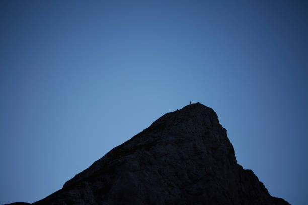 istock a beautiful large mountain at night with blue sky 1300480019
