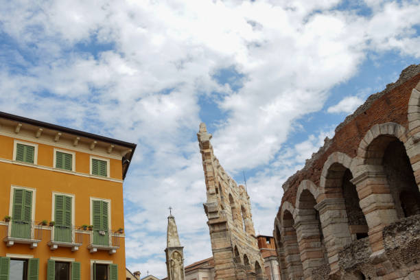 City of love, Arena in Verona, Italy during summer coronavirus against a blue sky background City of love, Arena in Verona, Italy during summer coronavirus against a blue light sky background verona opera stock pictures, royalty-free photos & images