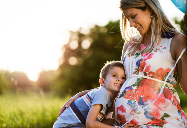 istock Pregnant mother and her son sharing love 1300483377