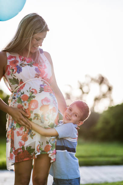 istock Pregnant mother and her son sharing love 1300483457
