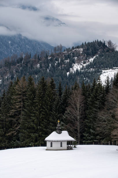 istock Chapel in the snowy mountains in Mautern, Austria 1300483492