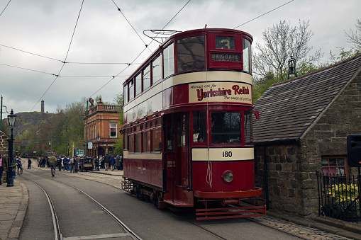Crich, England - April 17, 2017: Vintage Tram at the World War II - Home Front 1940s event at Crich Tramway Village in Derbyshire, UK, home of the National Tramway Museum.