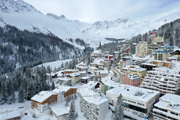 Arosa panorama in winter Arosa the swiss skiing and hiking tourist resort in the canton of graubünden captured during winter season. The high angle image shows several holiday apartments and hotels after several days snowing. arosa photos stock pictures, royalty-free photos & images