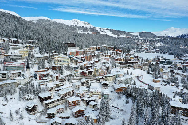 Arosa panorama in winter Arosa the swiss skiing and hiking tourist resort in the canton of graubünden captured during winter season. The high angle image shows several holiday apartments and hotels after several days snowing. arosa stock pictures, royalty-free photos & images