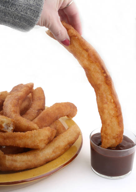 istock fried sugar bars with hot chocolate as typical spanish snack 1300487342