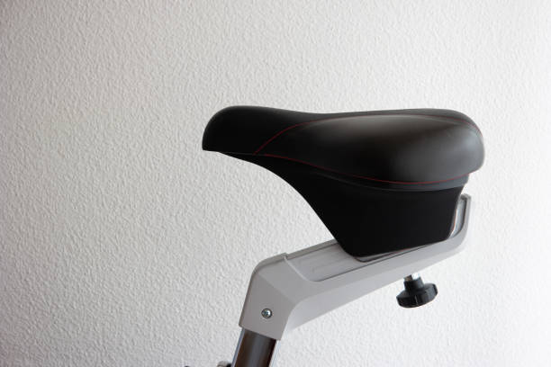 Indoor exercise bike saddle close up shot isolated on white stock photo