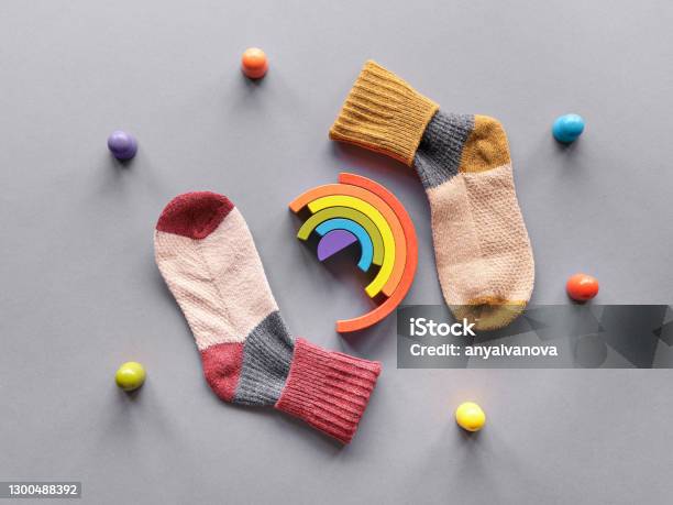 Odd Socks Daymismatched Socks Wooden Rainbow And Toy Figures Social Initiative Against Bullying In School Or Workplace Design For Antibullying Campaign Poster Stock Photo - Download Image Now
