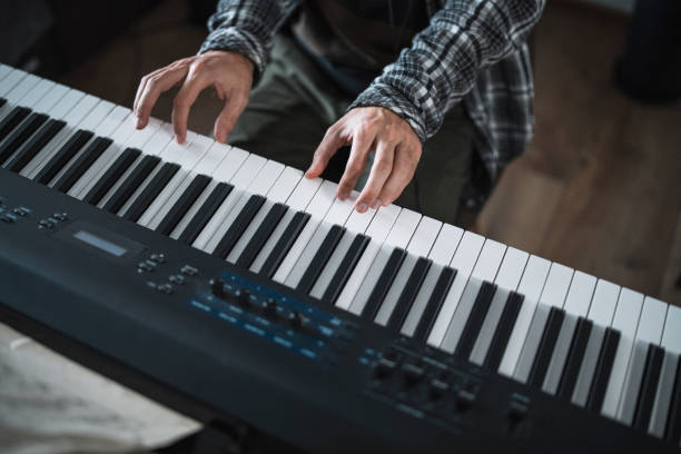 istock Shot of a man hands playing piano. 1300488765