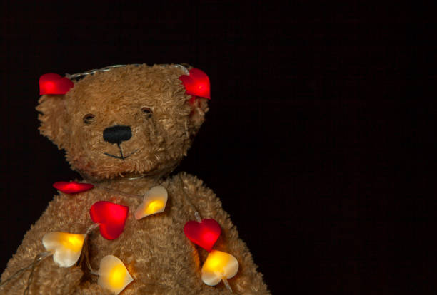 istock image of toy bear garland dark background 1300489030