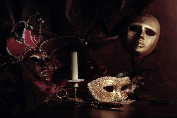 istock Carnival masks and small brass candlestick. 1300489217