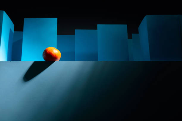 Tangerine in paper labyrinth. Concept of theme of bureaucracy.