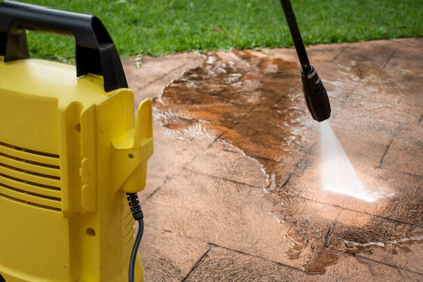 Cleaning backyard paving tiles with pressure washer. Cleaning backyard paving tiles with pressure washer. Spring clean up Pressure Washers stock pictures, royalty-free photos & images