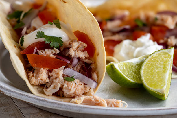 istock Chicken Taco With Tomato, Onion and Sour Cream 1300493872