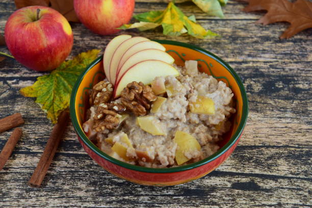 istock Apple oat porridge with cinnamon and walnut. Healthy breakfast 1300494115