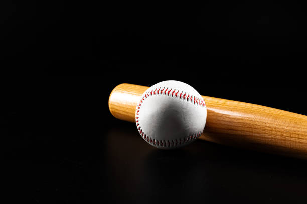 istock Baseball game equipment on dark black background 1300495120