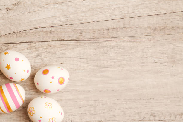 istock Colorful handmade painted easter eggs on a wood background. 1300495831