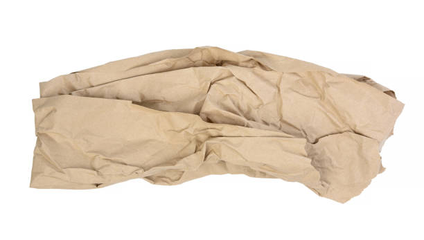 istock piece of crumpled brown paper isolated on white background, element for designer 1300498381