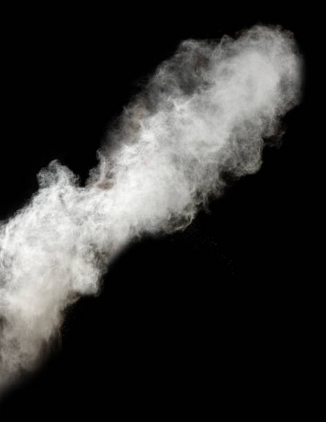 istock cloud of white wheat flour on a black background, particles fly in different directions 1300498472