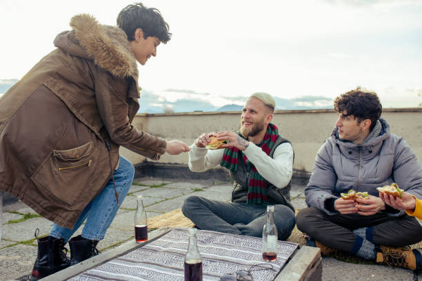 istock Happy Friends Enjoy Rooftop Party 1300498517