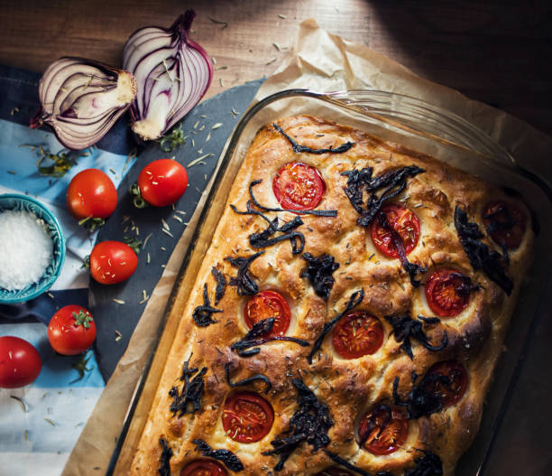 istock Focaccia Italian Bread with Cherry Tomatoes and Caramelized Onions 1300498951