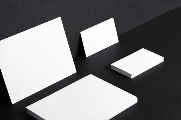 istock White businesscards on black background close up 1300499173