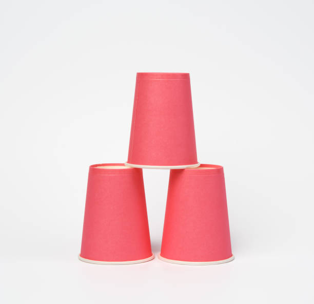 istock pink paper disposable cups on a white background 1300499358