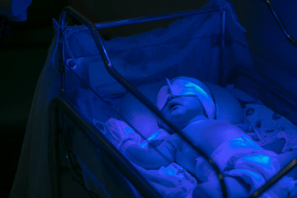 Baby Suffering From Jaundice Lying Under Ultraviolet Light In Incubator