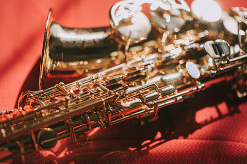 saxophone on sofa with morning sunlight shinny reflection