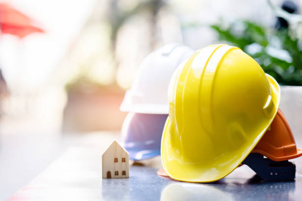 istock Group Safety Construction Worker Hats. Teamwork of the construction team must have quality. Whether it is engineering, construction workers. Have a helmet to wear at work. For safety at work. 1300509109