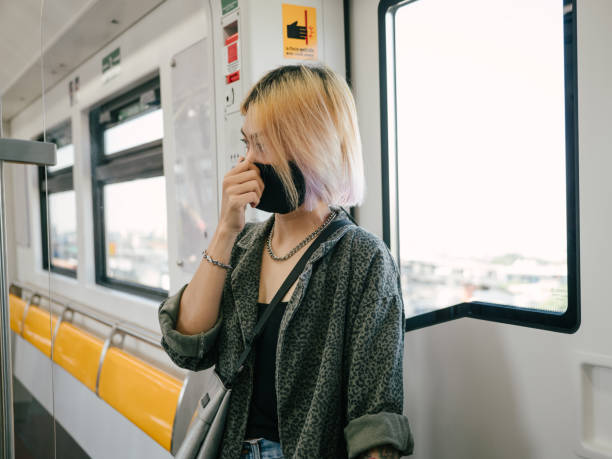 istock Asian female wearing face mask 1300509364