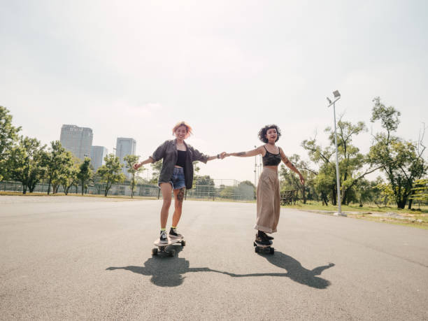 istock Asian girls skateboarder practicing in the public park. 1300509506