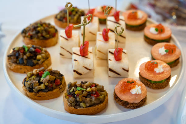 istock catering. canapes. snacks for holiday. small sandwiches. 1300509513