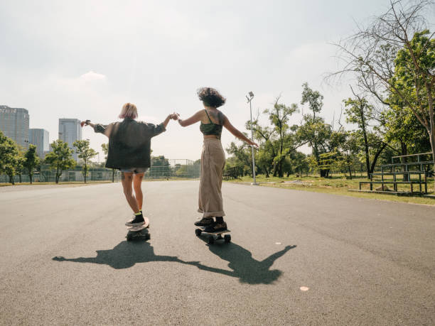 Asian girls skateboarder practicing in the public park.
