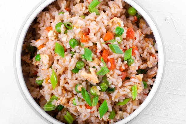 istock Fried rice with vegetables and egg in the gray ceramic bowl 1300512077