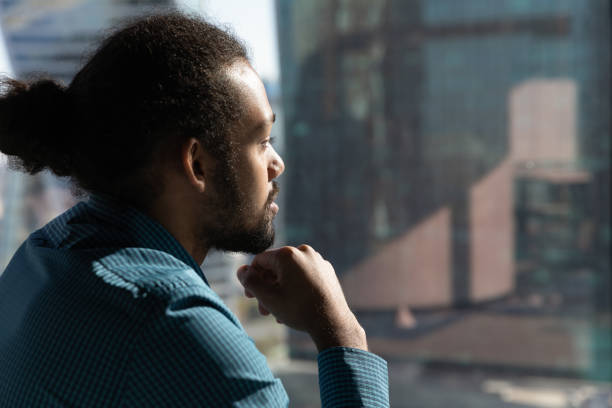 istock Pensive African American man look in distance thinking 1300512222