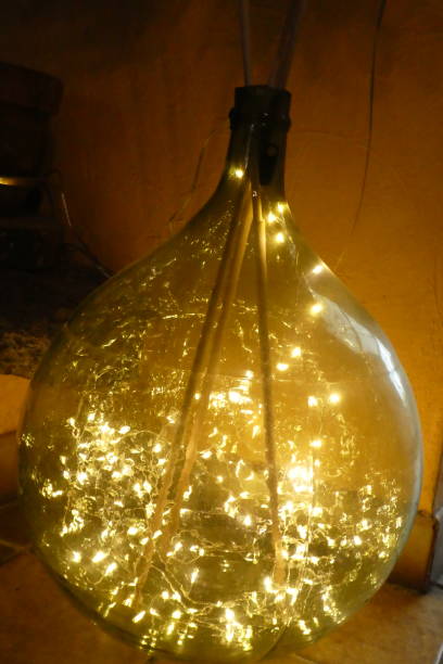 istock glass vase called Dame-jeanne with a garland inside for decoration 1300512302