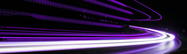 istock violet car lights at night. long exposure 1300514324