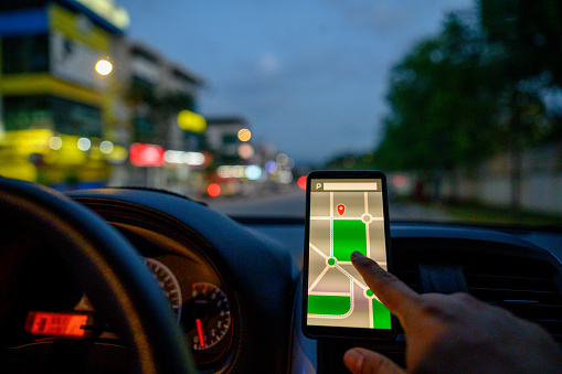 Driver Using. Map Driver Using Maps App For Showing The Right Route Through The Traffic ...