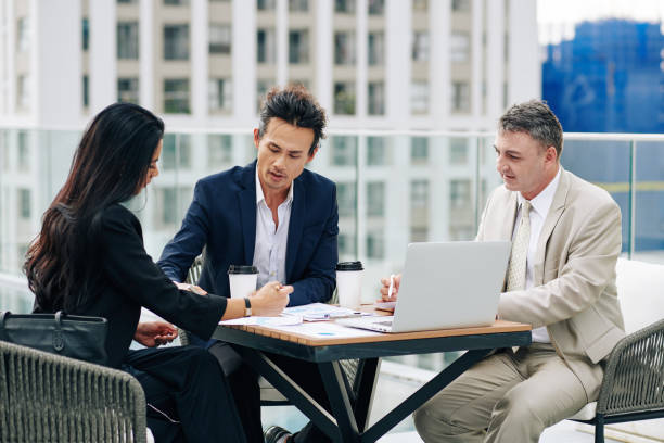 istock Business people discussing reports and suggestions 1300514982