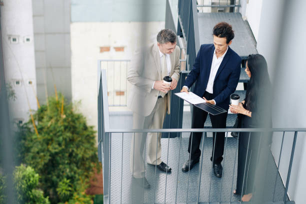 istock Entrepreneur showing report to colleagues 1300514988