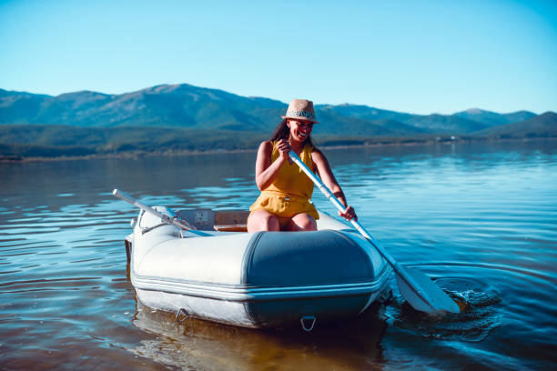 istock Lake Boat Trip For Modern Female Enjoying Vacation 1300515621